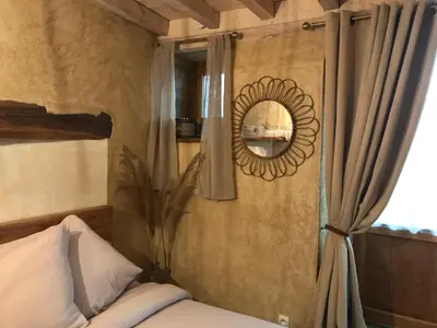 Un ou plusieurs lits dans un hébergement de l'établissement Chambre Les Marguerites