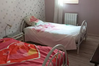 Un ou plusieurs lits dans un hébergement de l'établissement Maison au centre de Quingey