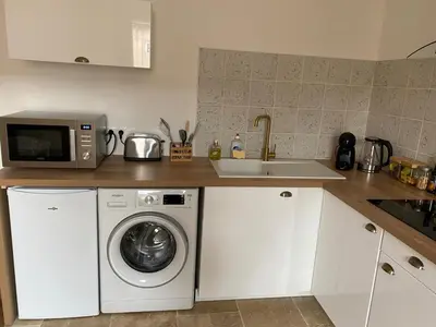 Cuisine ou kitchenette dans l'établissement Hilo Charming Appartment Saint Laurent Sur Sane