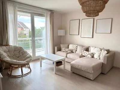 Coin salon dans l'établissement Charmant appartement tout confort