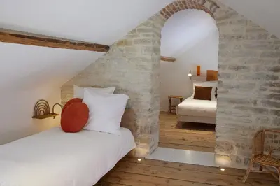 Un ou plusieurs lits dans un hébergement de l'établissement Couette&Living - Maison design à Savigny-les-Beaune