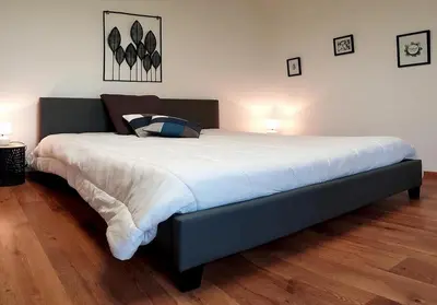 Un ou plusieurs lits dans un hébergement de l'établissement LE CLOS DES PRAIRIES Suite 2 grandes chambres