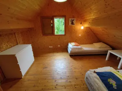 Un ou plusieurs lits dans un hébergement de l'établissement Gîte Chalet Morvan Bourgogne