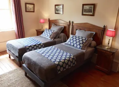 Un ou plusieurs lits dans un hébergement de l'établissement Appartements de la Côte