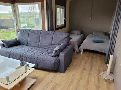 Coin salon dans l'établissement Maison au bord du canal