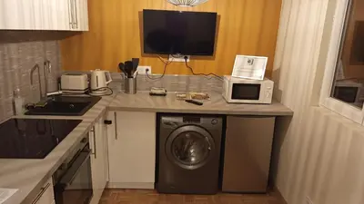 Cuisine ou kitchenette dans l'établissement Le petit cocon