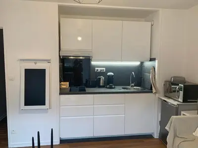 Cuisine ou kitchenette dans l'établissement Studio Tivoli la Tour