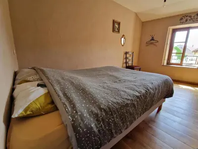 Un ou plusieurs lits dans un hébergement de l'établissement 2 CHAMBRES DANS MAISON EN PIERRE ATYPIQUe
