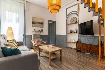 Télévision ou salle de divertissement dans l'établissement Le zen