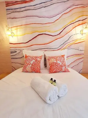 Un ou plusieurs lits dans un hébergement de l'établissement Cabanes du Domaine des Fées