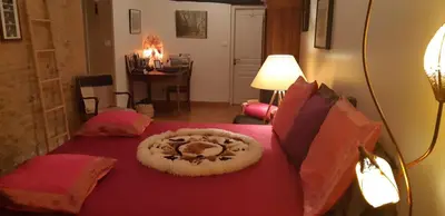 Un ou plusieurs lits dans un hébergement de l'établissement Bell'Accueil Chambres d'Hôtes Cluny