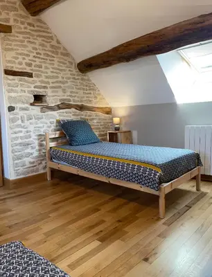 Un ou plusieurs lits dans un hébergement de l'établissement Le Cocon et le panorama des Hautes-Côtes