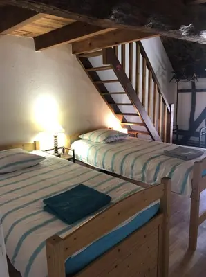 Un ou plusieurs lits dans un hébergement de l'établissement Grand gîte de charme à 10 min de Beaune 11-13 pers