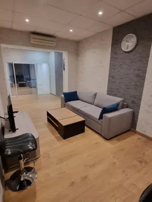 Coin salon dans l'établissement Appartement Centre ville
