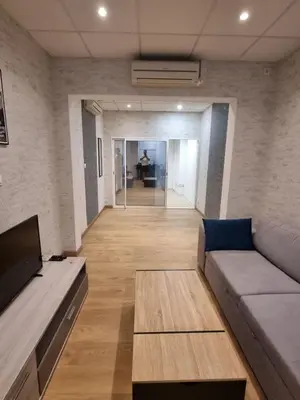 Coin salon dans l'établissement Appartement Centre ville