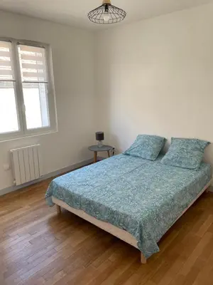 Un ou plusieurs lits dans un hébergement de l'établissement cosy et calme au cœur de la ville