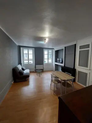 Coin salon dans l'établissement Appartement Le Suly