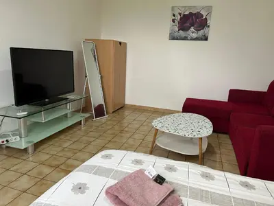 Télévision ou salle de divertissement dans l'établissement Chambre