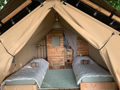 Un ou plusieurs lits dans un hébergement de l'établissement Tente lodge la Flavignienne