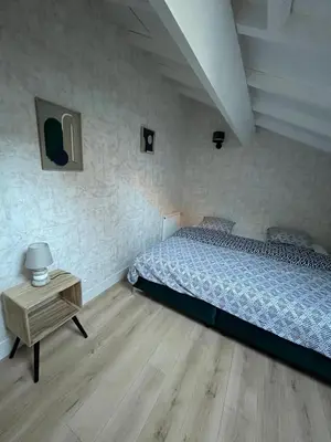 Un ou plusieurs lits dans un hébergement de l'établissement appart hôtel le 8 LE DUPLEX