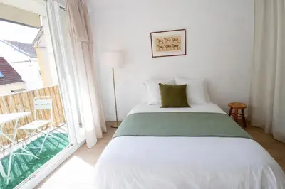 Un ou plusieurs lits dans un hébergement de l'établissement Le Caballo - Appartement de charme à Digoin