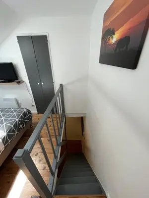 Télévision ou salle de divertissement dans l'établissement Logement au coeur de dole