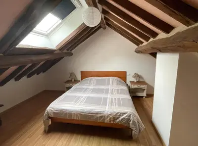 Un ou plusieurs lits dans un hébergement de l'établissement Gîte les érables
