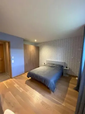 Un ou plusieurs lits dans un hébergement de l'établissement Maison ossature bois