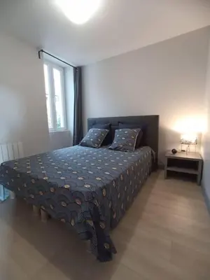 Un ou plusieurs lits dans un hébergement de l'établissement Appartement Le palais autun