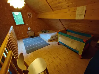 Un ou plusieurs lits dans un hébergement de l'établissement Gîte Chalet Morvan Bourgogne