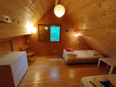 Un ou plusieurs lits dans un hébergement de l'établissement Gîte Chalet Morvan Bourgogne