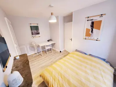 Un ou plusieurs lits dans un hébergement de l'établissement Appartement de Louise et Adrien