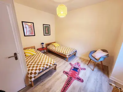 Un ou plusieurs lits dans un hébergement de l'établissement Appartement de Louise et Adrien