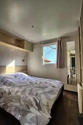 Un ou plusieurs lits dans un hébergement de l'établissement Mobilhome 3 chambres 6 personnes