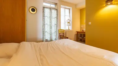 Un ou plusieurs lits dans un hébergement de l'établissement Le Clos de Pommard