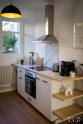 Cuisine ou kitchenette dans l'établissement Le Métropolitan