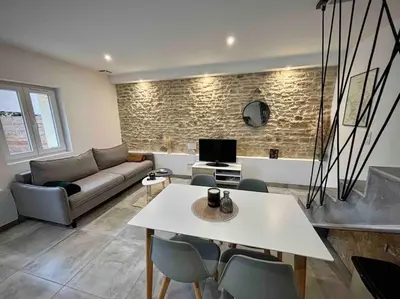 Télévision ou salle de divertissement dans l'établissement Grange rénovée en duplex idéalement située