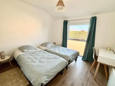 Un ou plusieurs lits dans un hébergement de l'établissement Grange rénovée en duplex idéalement située