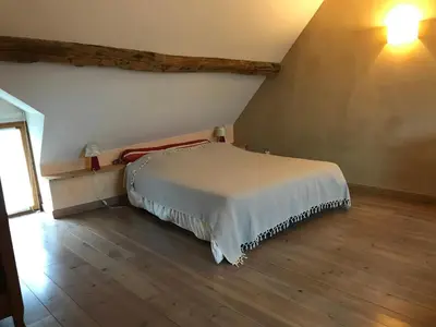 Un ou plusieurs lits dans un hébergement de l'établissement GITE LES PETITS GALETS Bourgogne du Sud