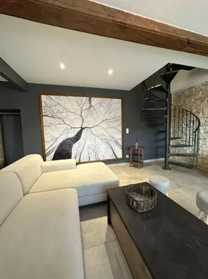 Coin salon dans l'établissement Gîte 10 personnes avec spa privatif