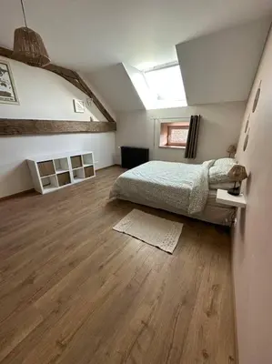 Un ou plusieurs lits dans un hébergement de l'établissement Gîte 10 personnes avec spa privatif