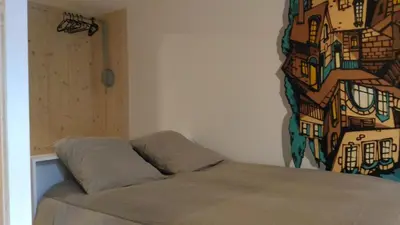 Coin salon dans l'établissement Lons appartement T1 centre ville