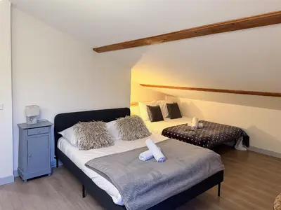 Un ou plusieurs lits dans un hébergement de l'établissement La Casa Del Papa - Maison spacieuse avec jardin