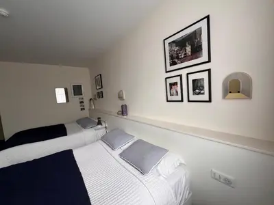 Un ou plusieurs lits dans un hébergement de l'établissement Le Téméraire Hôtel