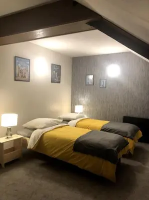 Un ou plusieurs lits dans un hébergement de l'établissement La maison de Jeanne