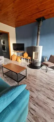 Coin salon dans l'établissement Gite du bourbouillon