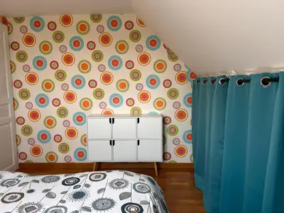 Un ou plusieurs lits dans un hébergement de l'établissement La maison de Lilylou