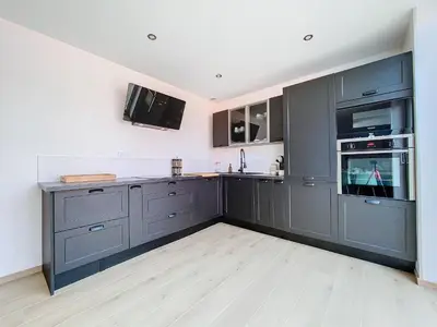 Cuisine ou kitchenette dans l'établissement Résidence de la Tille