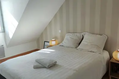 Un ou plusieurs lits dans un hébergement de l'établissement Superbe duplex « le Grévy »