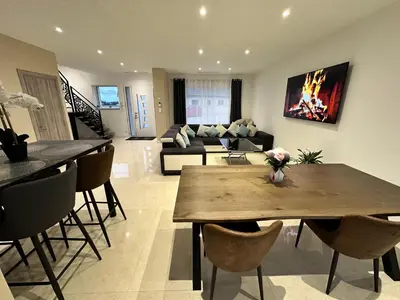 Coin salon dans l'établissement Comme a la maison 6